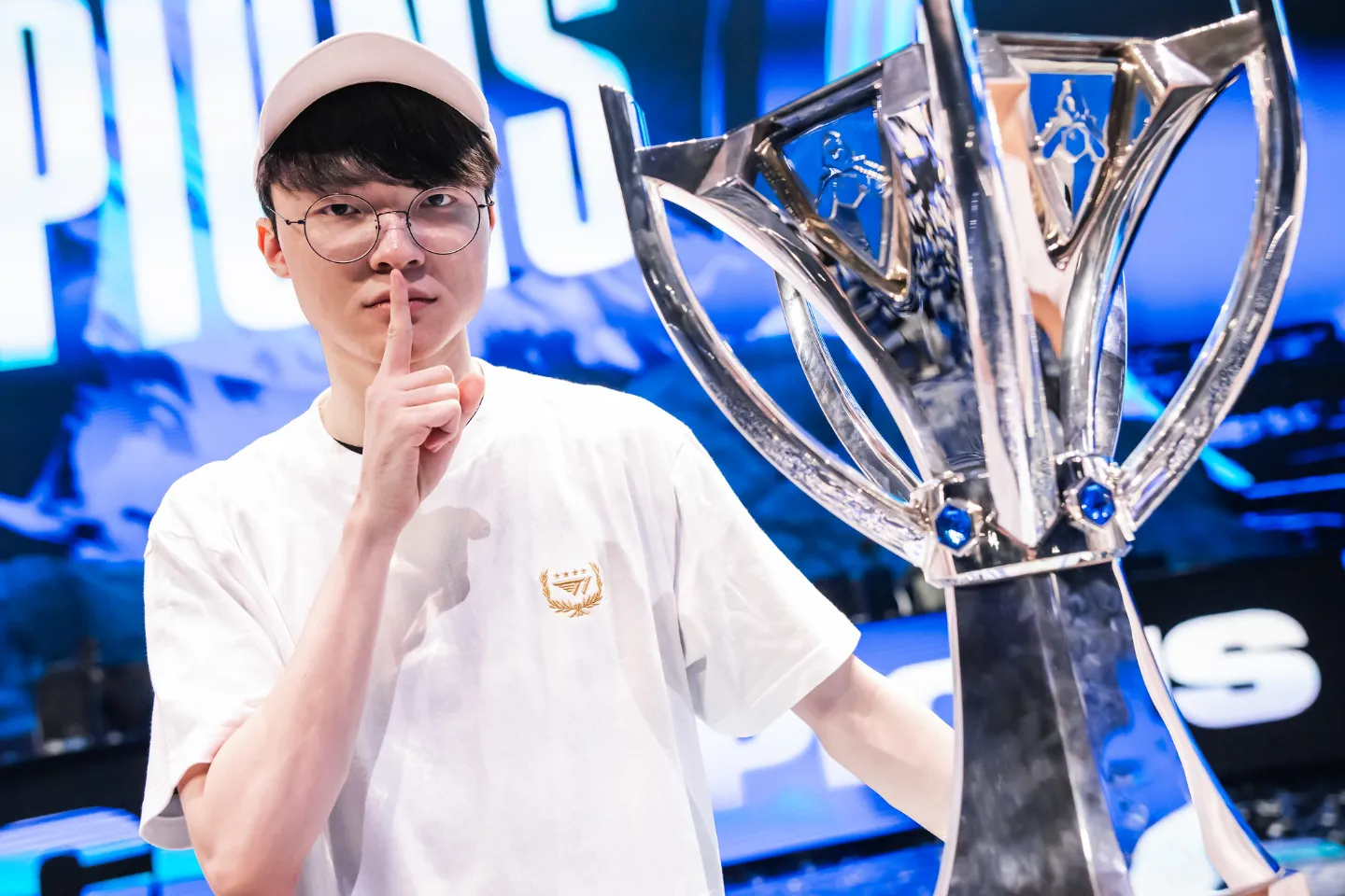 Lee "Faker" Sang-hyeok of T1 poses with trophy onstage after victory at League of Legends World Championship 2023 Finals at Gocheok Sky Dome